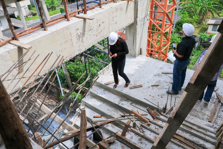 businessman and woman engineering in construction building working site