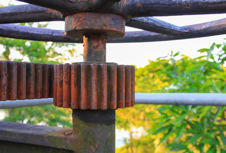 rusty gear toothed wheels old water valve select focus with shallow depth of field.の写真素材