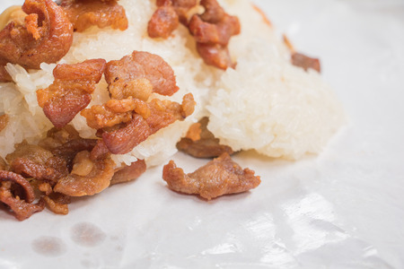 pork fried Close up with sticky rice on wrap paper fast food Thailandの写真素材
