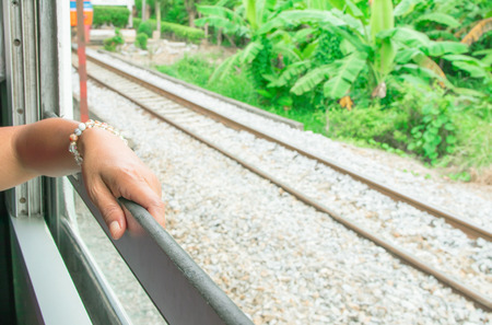 Woman hands on train window travel summer with copy space add textの写真素材