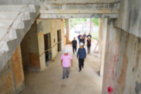 blur of group businessman engineering check in construction building working site with copy space add textの写真素材