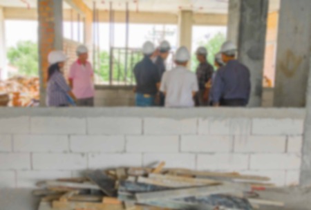 blur of group businessman engineering check in construction building working site with copy space add textの写真素材
