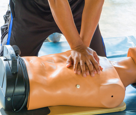 hand Heart pump with medical dummy on CPR, in emergency refresher training to assist of physician