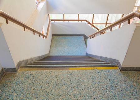 stairs blue old terrazzo floor walkway down Inside the building. select focus with shallow depth of field.の写真素材