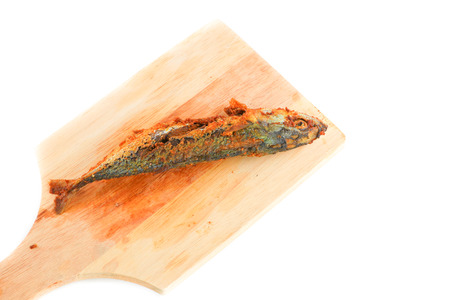 close up fried mackerel  on cutting board isolated  white background and clipping path.