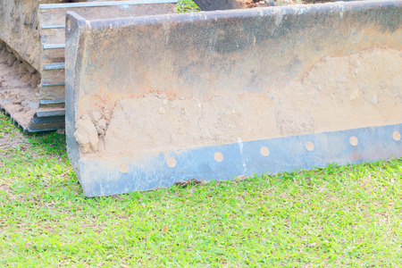 excavator bucket close up On the green grass