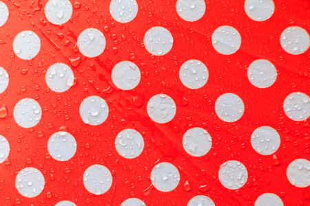water drop on a waterproof fabric point Red and white beautiful background  with copy spaceの写真素材