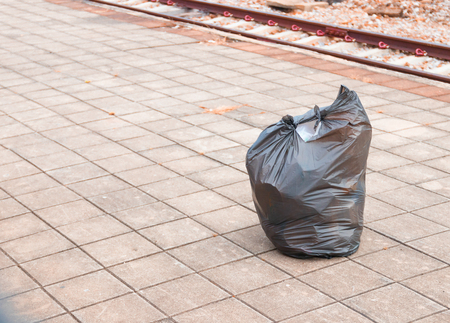 black garbage bag on train stationの写真素材