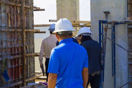 engineer consult construction site To plan development on housing High rise building