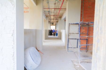 blur interior in construction and wall decoration at building site with engineerの写真素材