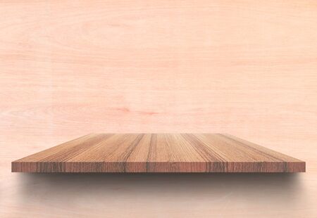 Empty top wooden shelves and woody wall background. For product display with copy space add text