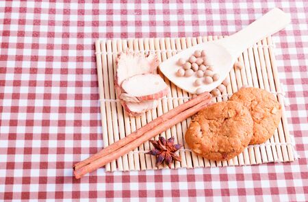 cereal cookies with spoon spice on wooden bamboo and tablecloth 
copy space for text. top viewの写真素材