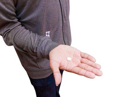 pills in hand male isolated on white backgroundの写真素材