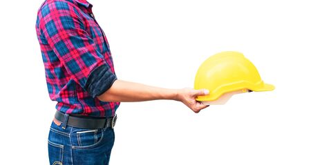 Engineer hold yellow safety helmet plastic construction concept  isolated on white backgroundの写真素材