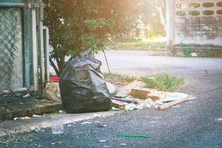 plastic trash bag. Pile black garbage roadsideの写真素材