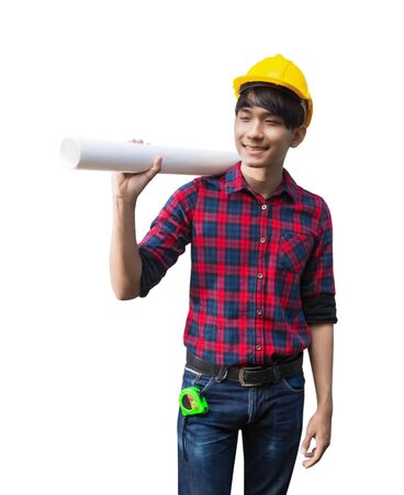Engineer smile and holding rolled blueprints construction on shoulder wear yellow safety helmet plastic on white backgroundの写真素材