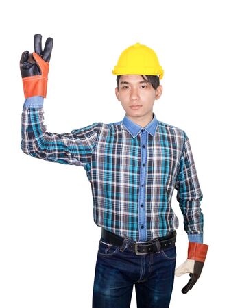 Businessman engineer pointing up with fingers number two symbol and wear wear yellow safety helmet plastic on white backgroundの写真素材