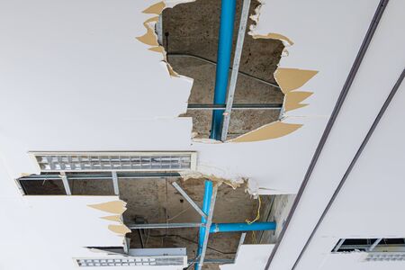 repair leak water pipe on gypsum ceiling interior office building