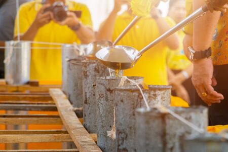 candle casting Buddhist religion tradition. select focus with shallow depth of fieldの写真素材