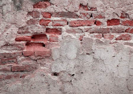 red brick block wall texture old background ancient weathered brick wall with cracks and destroyed stucco layer with copy spaceの写真素材