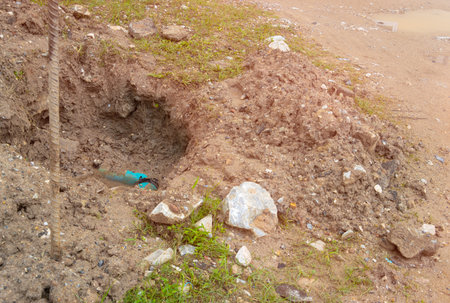 plumbing broken plastic pipe in the hole and water in wait repairの写真素材