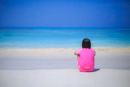 Girl sitting on the beachの写真素材