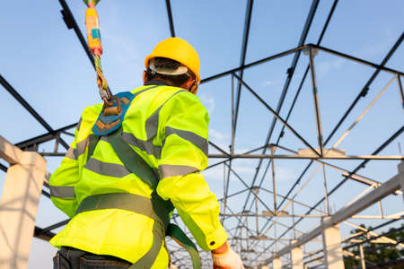 Safety height equipment in the construction site; Asian worker wear safety height equipment to...