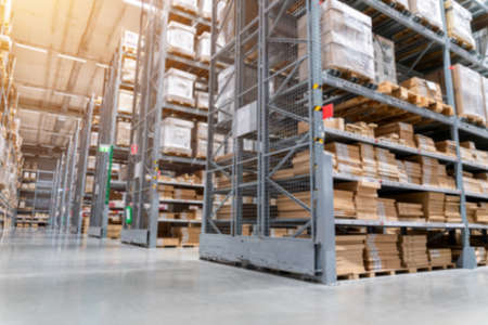blurred background picture of  Rows of shelves with goods boxes in modern industry warehouse store at factory warehouse storage for logisticの写真素材
