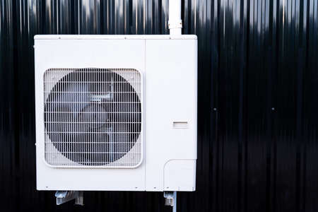 New Air Conditioning outdoor unit compressor install outside the houseの写真素材