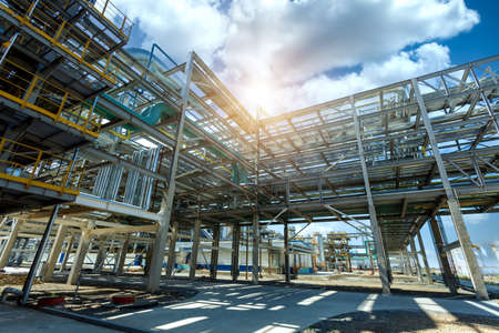 Pipeline oil and gas refinery plant form industry zone with sunrise and cloudy sky, oil and gas industrial concept.の写真素材