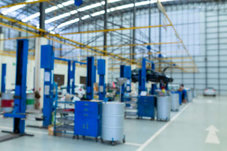 Blurred Car lift in auto car repair service centerの写真素材