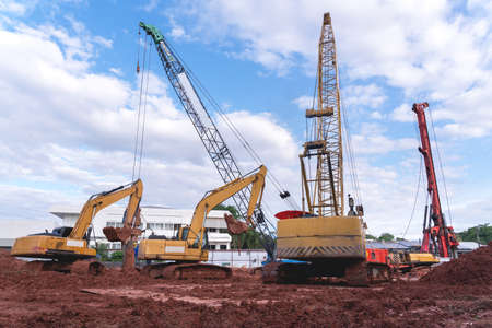 excavator heavy machine and mobile crane tower crane in new construction siteの写真素材