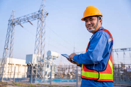 Happy asian electric engineer check the transmission station.の写真素材