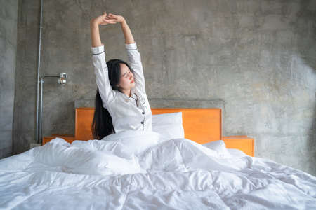 Asian woman stretching in the morning, She felt very refreshed.の写真素材