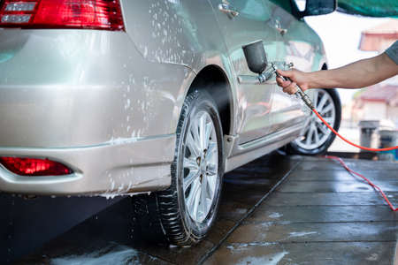Car washing at the car wash shop to clean up dirt and keep the health of the driver and passengers, Car wash service concept.の写真素材