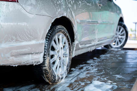 Washing car with soap, Car wash service concept.の写真素材