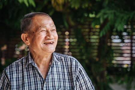 close-up portrait of happy asian senior man look with hope. Old thai man, Healthy senior conceptの写真素材