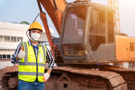 Portrait of Foreman Construction excavator, engineer or worker backhoe driver and crane wearing a...