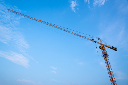 Construction crane, Industrial construction cranes and building at Construction site.の写真素材