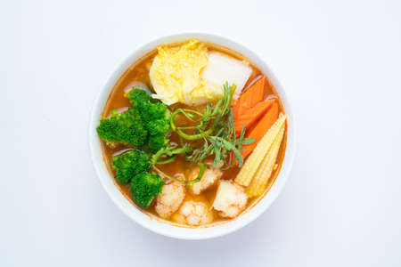Mixed Vegetable in Sour soup made of Tamarind Paste with Shrimps and Vegetable Omelet - Asian food style or Thai food style isolated on white backgroundの写真素材