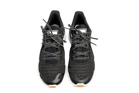 Sport shoes, black sport shoes isolated on white backgroundの写真素材