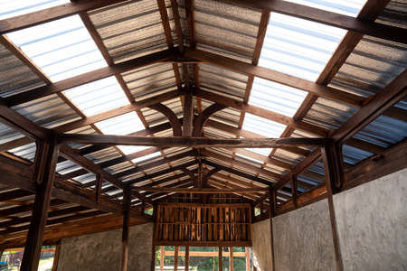 Under the translucent wooden roof structure on construction siteの写真素材