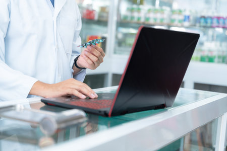 close up hand of pharmacist working at pharmacy. Medical healthcare concept.の写真素材