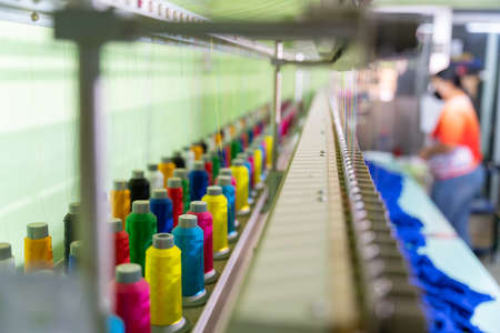 Multicolor sewing threads on industrial embroidery machine. select focus of Multicolor sewing threads. tailor sewing concept.の写真素材