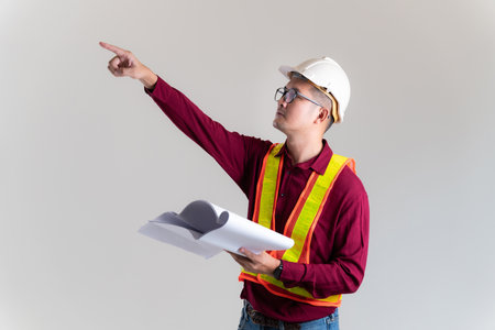 Architect civil engineer working with  blueprints in a studio. Architect, Engineer, Civil Concept of Construction.の写真素材