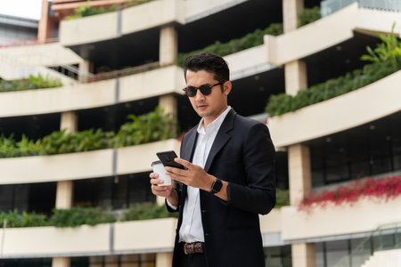 A Professionals Interacting With their devices in urban public spaces.の写真素材