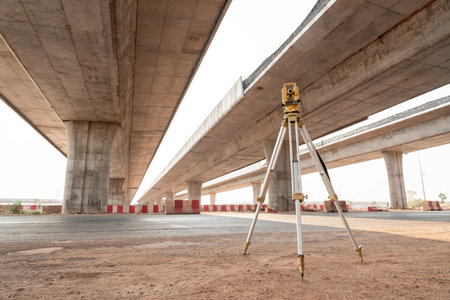 Surveyor equipment. theodolite for Civil Engineers at road construction site. Highway.の写真素材