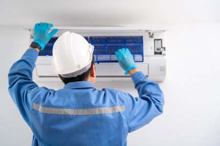 Air technician service cleaning air conditioner indoors. Service concept of an air conditioner technician.の写真素材