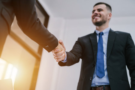 Business people shaking hands, finishing up a meeting. Concept of successful business people shaking hands.の写真素材