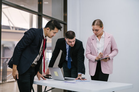 Teamwork meeting and business people in office workplace. Collaboration, technology and man, Research or financial strategy in company. Business meeting time.の写真素材
